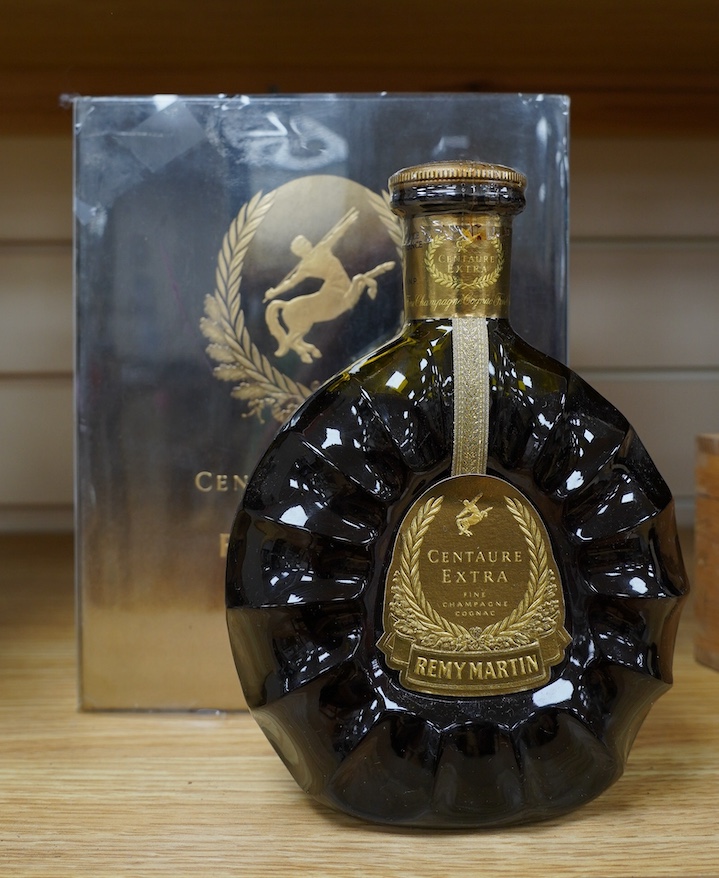 A boxed bottle of Remy Martin Centaure Extra Fine Champagne Cognac. Condition - good